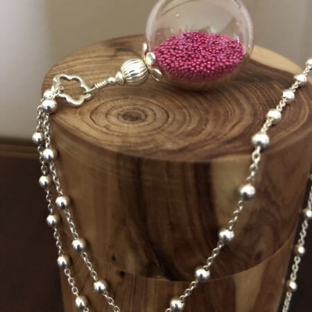 perle soufflée verre transparent micro perles rose vendu sans chaine